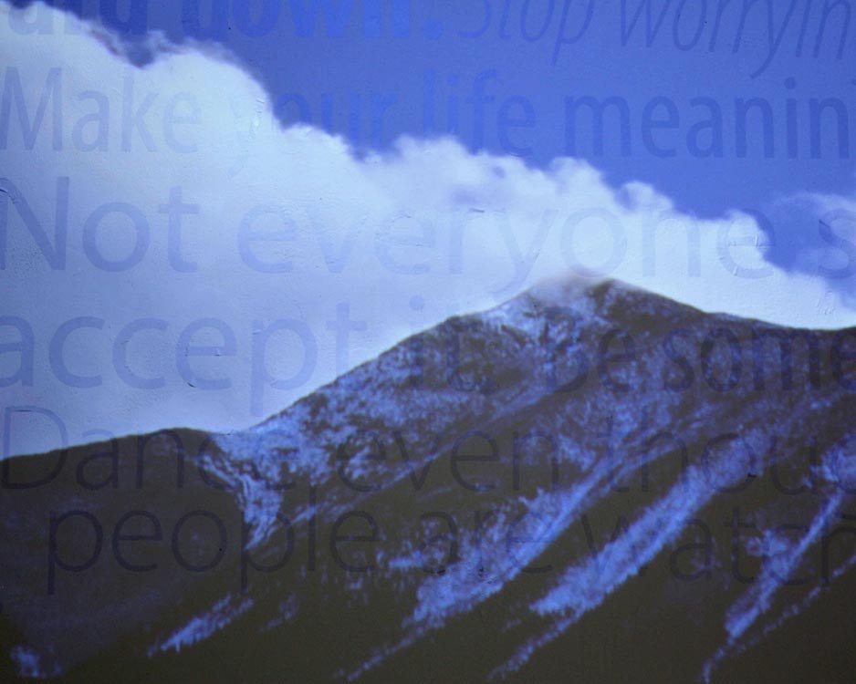 closeup of projected mountain on vinyl type on wall